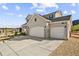 Stunning two-story home featuring a large driveway and a two-car garage at 5446 Mesa Top Dr, Monument, CO 80132