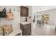 Stylish mudroom with a built-in bench, coat hooks, and convenient storage cabinets at 5446 Mesa Top Dr, Monument, CO 80132