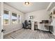 Bright home office with dual workstations, a large patterned rug, and ample natural light at 5446 Mesa Top Dr, Monument, CO 80132