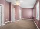 Large bedroom with natural light, neutral carpet, and access to a closet and bathroom at 232 W 5Th Ave, Denver, CO 80204