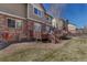 Backyard featuring a mulit-level deck with a brick house in the background at 6852 S Algonquian Ct, Aurora, CO 80016