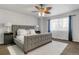 Bedroom with neutral color scheme featuring a large bed and ample natural light at 6852 S Algonquian Ct, Aurora, CO 80016