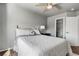 Inviting bedroom features a cozy bed, closet, and a bedside table with a lamp for comfortable living at 6852 S Algonquian Ct, Aurora, CO 80016