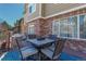 Outdoor deck featuring an outdoor dining table with seating for four at 6852 S Algonquian Ct, Aurora, CO 80016