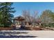 Community entrance with stone columns and manicured landscaping at 6852 S Algonquian Ct, Aurora, CO 80016