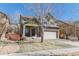 Inviting two-story home with a neatly landscaped front yard and a convenient two-car garage at 6852 S Algonquian Ct, Aurora, CO 80016