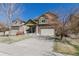 Beautiful home with a well-manicured lawn and a spacious driveway leading to a two-car garage at 6852 S Algonquian Ct, Aurora, CO 80016