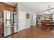 Modern kitchen with stainless steel refrigerator and ample cabinet space for storage and appliances at 6852 S Algonquian Ct, Aurora, CO 80016