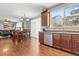 Open floor plan of the kitchen seamlessly connects to the dining area and living room for easy living at 6852 S Algonquian Ct, Aurora, CO 80016