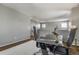 Bright office area featuring a contemporary desk and comfortable seating, perfect for productivity at 6852 S Algonquian Ct, Aurora, CO 80016