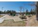 Community playground with multiple structures and soft ground covering at 6852 S Algonquian Ct, Aurora, CO 80016