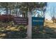 Community sign directing towards swimming pool, tennis courts, club house, and Homestead at 6852 S Algonquian Ct, Aurora, CO 80016