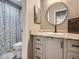 Well-lit bathroom with granite countertop, framed mirror, and modern fixtures at 4068 S Atchison Way # 101, Aurora, CO 80014