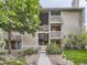 Charming condo with multiple balconies, well-maintained landscaping and stone pathway to the entrance at 4068 S Atchison Way # 101, Aurora, CO 80014
