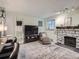 Inviting living space with fireplace and comfortable seating and pass-through to the bar counter at 4068 S Atchison Way # 101, Aurora, CO 80014