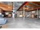 Unfinished basement with concrete floors and exposed ceiling at 10650 Yellowstone Rd, Longmont, CO 80504
