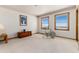 Spacious bedroom with great natural light from the two windows and carpet throughout at 10650 Yellowstone Rd, Longmont, CO 80504