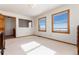 Bright bedroom with two windows offering stunning panoramic views at 10650 Yellowstone Rd, Longmont, CO 80504
