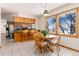 Bright breakfast nook with a round table, comfortable chairs, and scenic views at 10650 Yellowstone Rd, Longmont, CO 80504