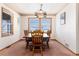 Cozy dining room featuring a wooden table, comfortable seating, and views of the mountains at 10650 Yellowstone Rd, Longmont, CO 80504