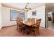 Charming dining room with a large wooden table, mountain views, and room to entertain at 10650 Yellowstone Rd, Longmont, CO 80504