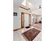Welcoming entryway featuring tile flooring, natural lighting and an ornate rug at 10650 Yellowstone Rd, Longmont, CO 80504