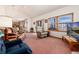 Bright living room featuring a vaulted ceiling, a large window, and an open layout at 10650 Yellowstone Rd, Longmont, CO 80504