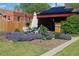 Landscaped backyard with seating, a patio, and manicured garden beds at 1363 Stuart St, Denver, CO 80204