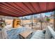 Inviting backyard patio with a covered seating area, playhouse, and comfortable outdoor furniture at 1363 Stuart St, Denver, CO 80204