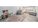 Finished basement featuring a large area rug, seating area, and play area at 1363 Stuart St, Denver, CO 80204