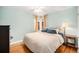 Comfortable bedroom featuring hardwood floors, a ceiling fan, and a cozy atmosphere at 1363 Stuart St, Denver, CO 80204