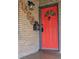 Stylish red front door with decorative window and distinctive hardware at 1363 Stuart St, Denver, CO 80204