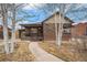 Charming brick home with a cozy front porch and well-maintained landscaping at 1363 Stuart St, Denver, CO 80204