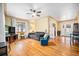Bright living room featuring hardwood floors, large windows, and a ceiling fan at 1363 Stuart St, Denver, CO 80204