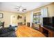 Spacious living room with hardwood floors, an archway, and two large windows with soft light at 1363 Stuart St, Denver, CO 80204