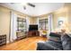 Comfortable living room with hardwood floors, two large windows, and stylish furnishings at 1363 Stuart St, Denver, CO 80204