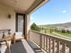 Relaxing balcony with mountain views, white railing, lounge chair, and shade at 15264 W La Salle Ave, Lakewood, CO 80228