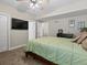 Bedroom with carpet, ceiling fan, television, and a comfortable king bed at 15264 W La Salle Ave, Lakewood, CO 80228