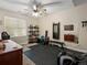 Bedroom with workout space, including a rower, weights, and a weight rack at 15264 W La Salle Ave, Lakewood, CO 80228