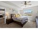 Bright bedroom features a large window with mountain views and a comfortable king-sized bed at 15264 W La Salle Ave, Lakewood, CO 80228