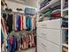 Spacious walk-in closet with custom shelving and storage, providing ample space for clothes, shoes, and accessories at 15264 W La Salle Ave, Lakewood, CO 80228