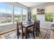 Lovely dining room with large windows and mountain views at 15264 W La Salle Ave, Lakewood, CO 80228
