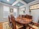 Formal dining room with tray ceiling and elegant furniture at 15264 W La Salle Ave, Lakewood, CO 80228