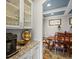 Dining room with serving area and coffered ceiling at 15264 W La Salle Ave, Lakewood, CO 80228