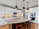 Gourmet kitchen with granite counters, stainless steel appliances, and a large island with seating at 15264 W La Salle Ave, Lakewood, CO 80228