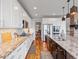 Spacious kitchen features granite counters, stainless appliances, and hardwood floors at 15264 W La Salle Ave, Lakewood, CO 80228