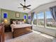 Vaulted ceiling and large windows highlight the main bedroom at 15264 W La Salle Ave, Lakewood, CO 80228