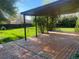 Covered back deck featuring a spacious outdoor area for relaxing, including view of backyard and dog house at 6139 S Adams Dr, Centennial, CO 80121