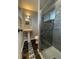 Modern bathroom with a tiled shower and pedestal sink at 6139 S Adams Dr, Centennial, CO 80121