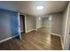 Neutral bedroom with vinyl plank floors, a closet, and access to other rooms of the house at 6139 S Adams Dr, Centennial, CO 80121